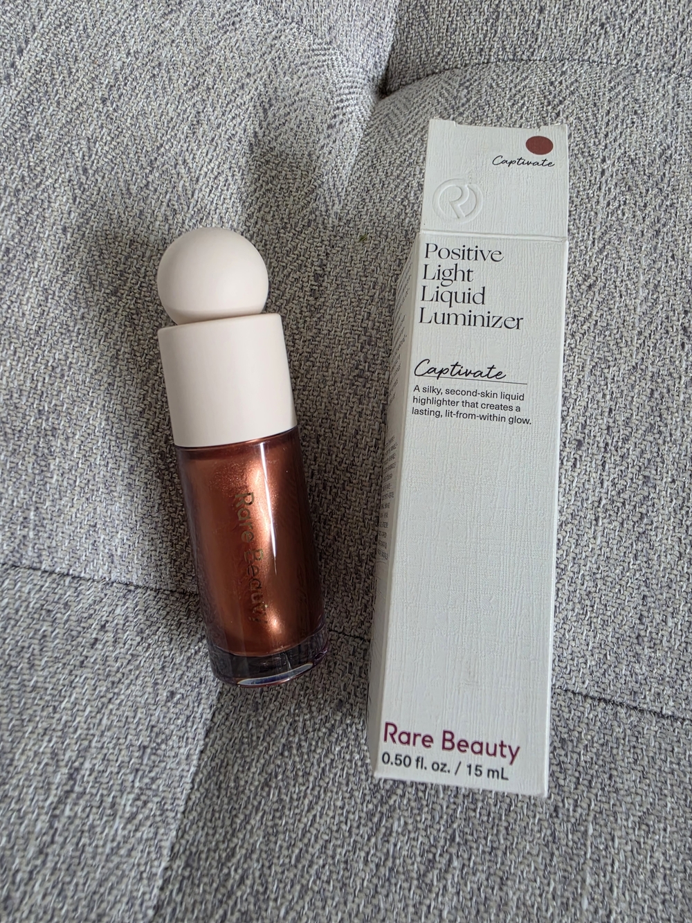 Rare Beauty Positive Light Liquid Luminizer — Captivate Warm Copper